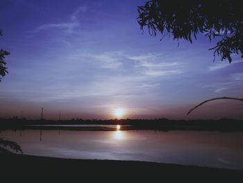 Scenic view of sea against sky at sunset