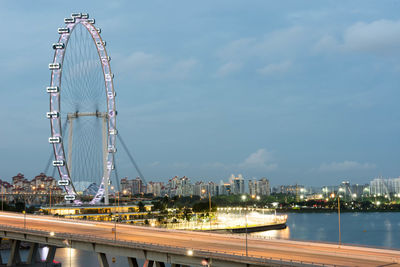 Ferris wheel in city against sky