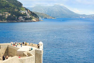 High angle view of tourists at observation point against adriatic sea