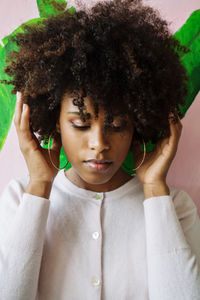 Beautiful black woman with afro hair against the colorful background