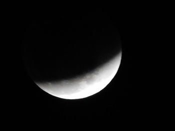 Low angle view of moon against sky at night