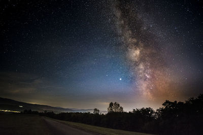 Scenic view of star field against sky at night