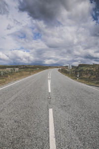 Empty road against sky