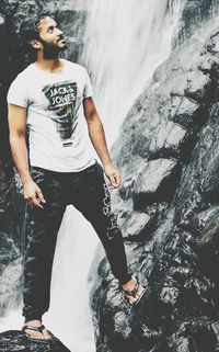 Full length of woman jumping in water