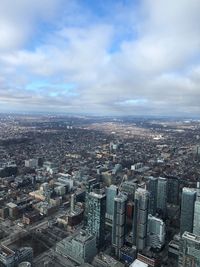 High angle view of modern buildings in city against sky