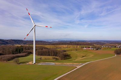 Aerial drone view of a wind turbine used to generate green electricity