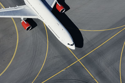 Aerial view of plane at airport. airplane taxiing to runway before take off.