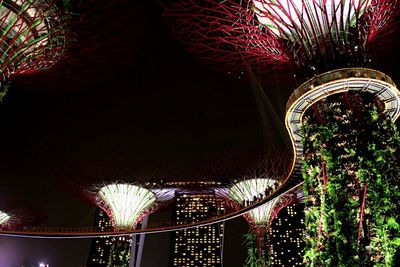 Low angle view of illuminated lights at night