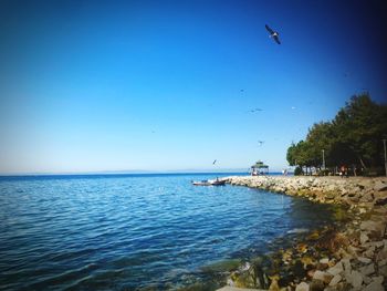 Scenic view of sea against clear sky