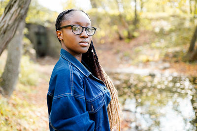 Portrait of young woman looking away