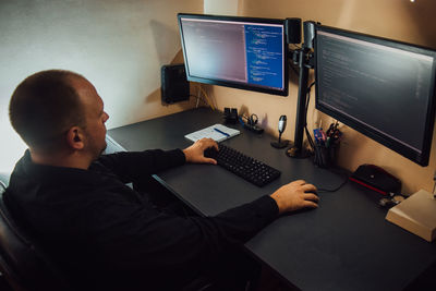 Man working on computers