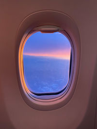 Directly below shot of sky seen through airplane window