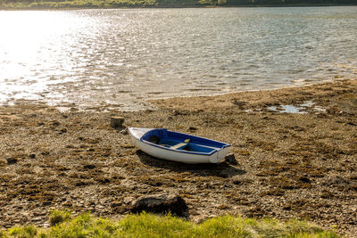 Boat moored on shore