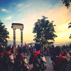 Group of people against sky during sunset