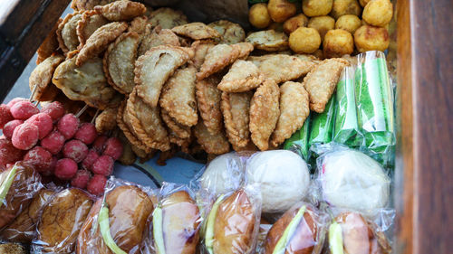 High angle view of traditional foods in sumbawa for sale at the wheel barrow food