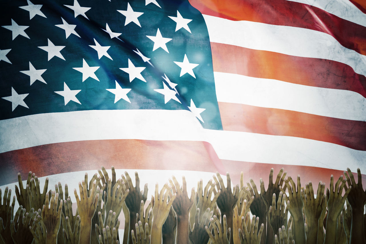 CLOSE-UP OF FRESH FLAGS AGAINST BLUE SKY