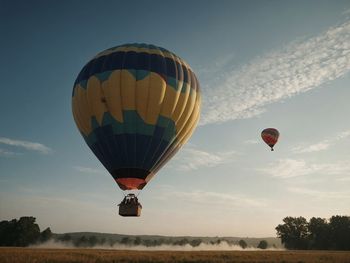 Hot air balloons against sky