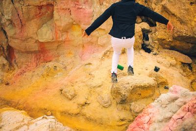 Full length of man standing on rock