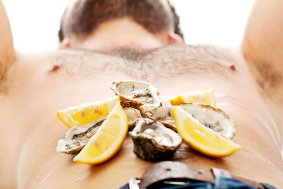 Close-up of man with fruits