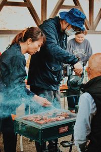 Man and woman standing on cutting board