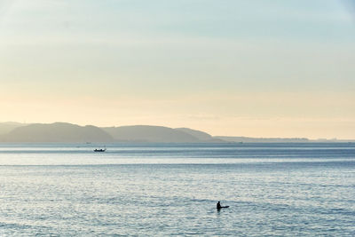 Scenic view of sea against sky during sunrise