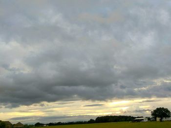 Storm clouds over field