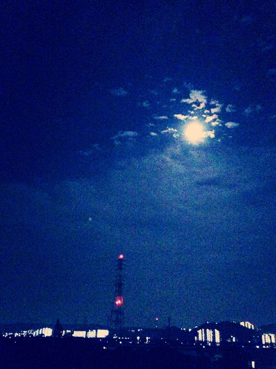 sky, night, illuminated, built structure, architecture, blue, silhouette, dusk, building exterior, low angle view, cloud - sky, dark, city, nature, connection, bridge - man made structure, outdoors, moon, transportation, no people