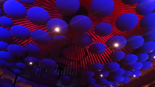 Low angle view of illuminated lights against sky