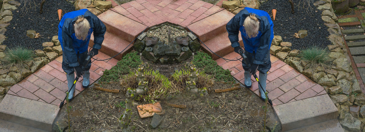 HIGH ANGLE VIEW OF STONE SCULPTURE ON FOOTPATH