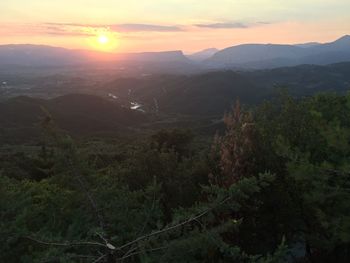 Scenic view of landscape against sky during sunset