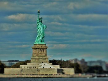 Low angle view of statue against cloudy sky