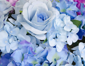 High angle view of artificial rose and hydrangeas