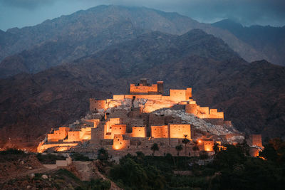 High angle view of buildings in city at night