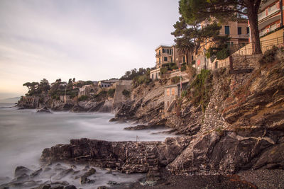 Panoramic view of sea and buildings against sky