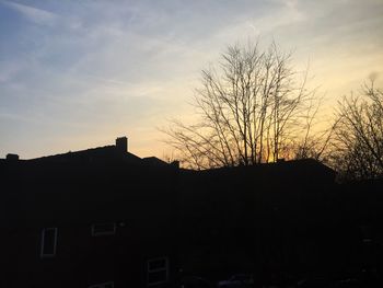 Silhouette of built structures at sunset