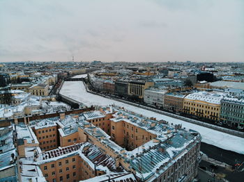 High angle view of buildings in city against sky