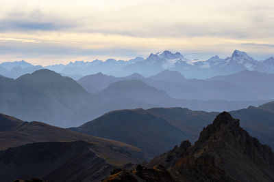 Scenic view of mountains against sky during sunset