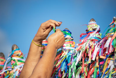 Cropped hand of woman holding christmas decoration