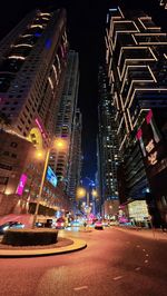 High angle view of illuminated buildings in city at night