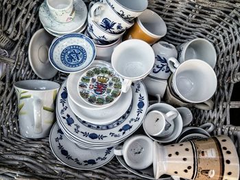 Directly above shot of porcelain containers in basket