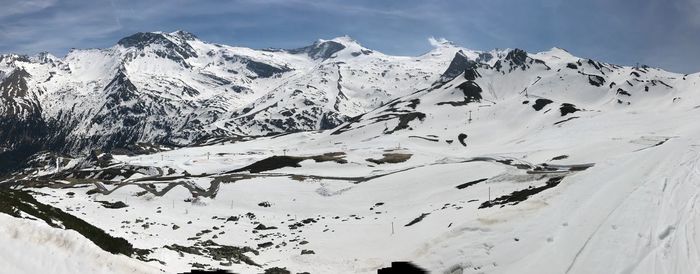 Scenic view of snowcapped mountains against sky