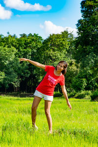 Full length of woman on field against sky