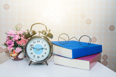 High angle view of clock on table