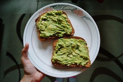 Cropped hand holding food