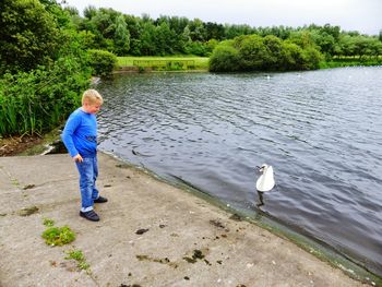 Full length of woman standing in water