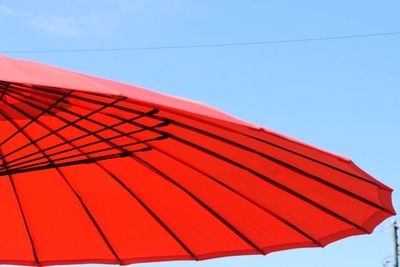 Low angle view of red wall