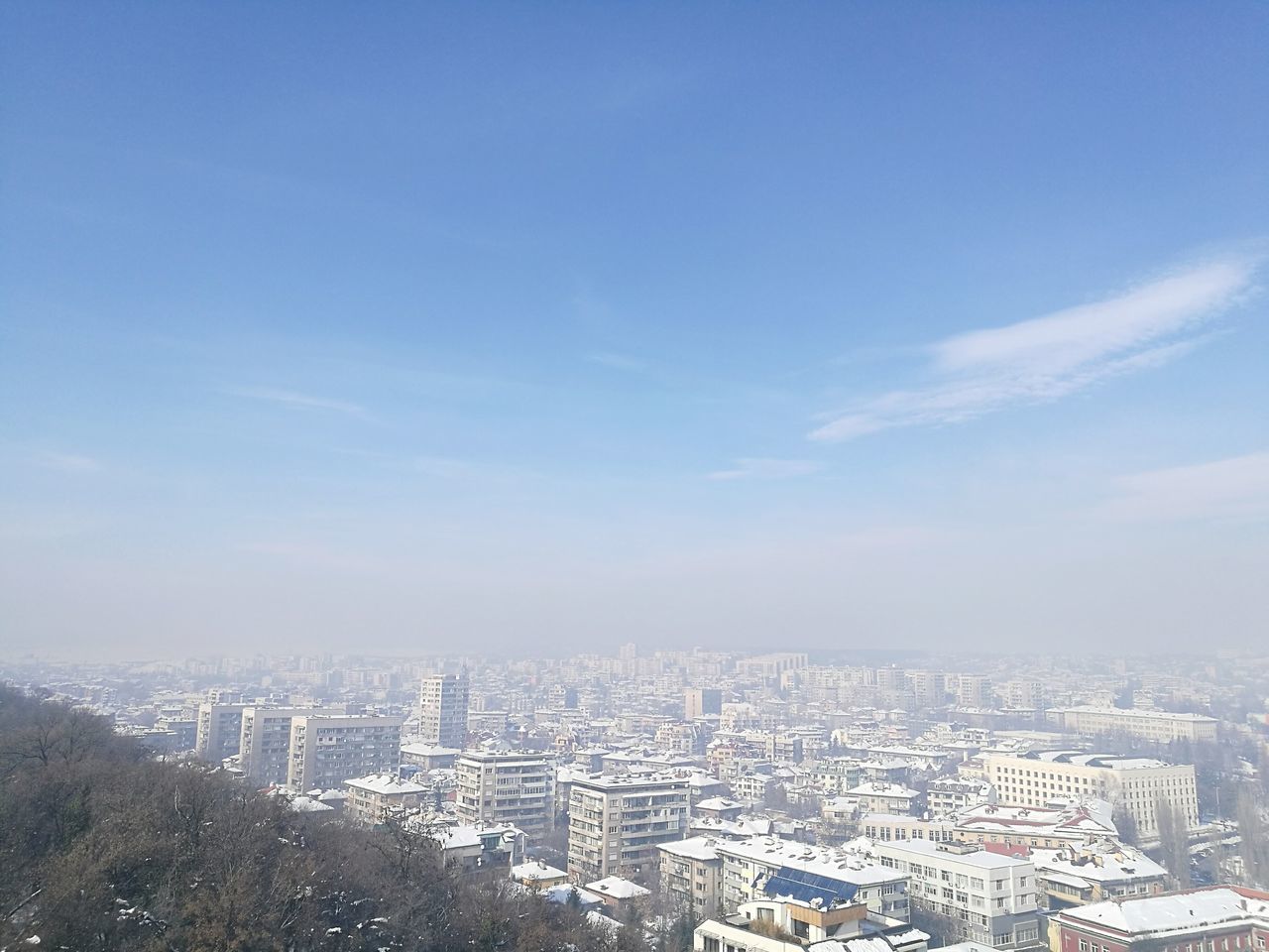 AERIAL VIEW OF CITY AGAINST SKY