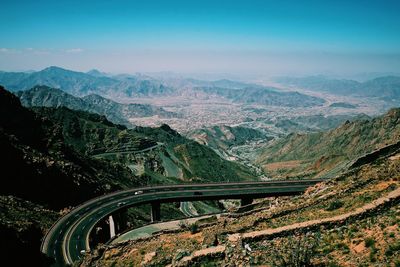 High angle view of road amidst mountains against sky