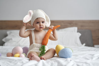 Cute girl playing with toy at home