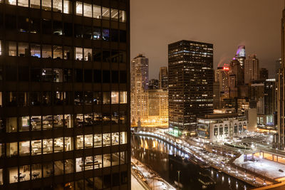 Illuminated buildings in city at night